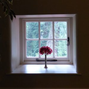 house window with flower vase