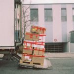 Image of packing boxes being loaded onto a moving van