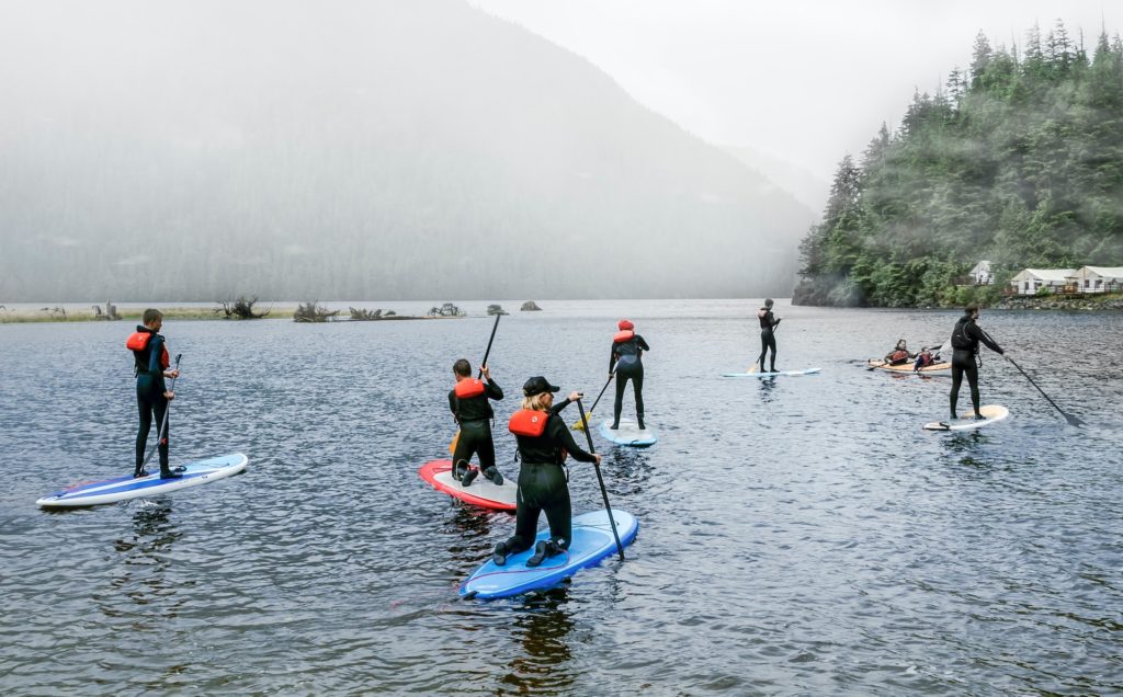 Image of people paddle boarding on a lake in Port Alberni